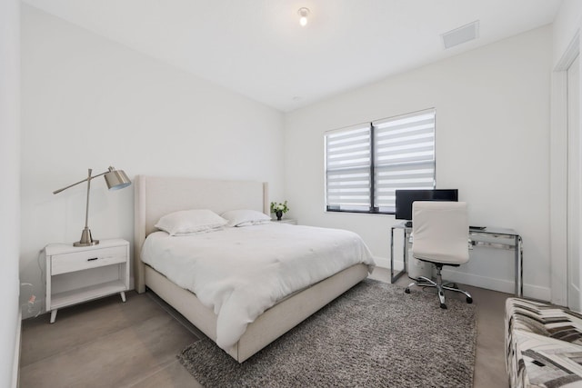 bedroom with concrete flooring