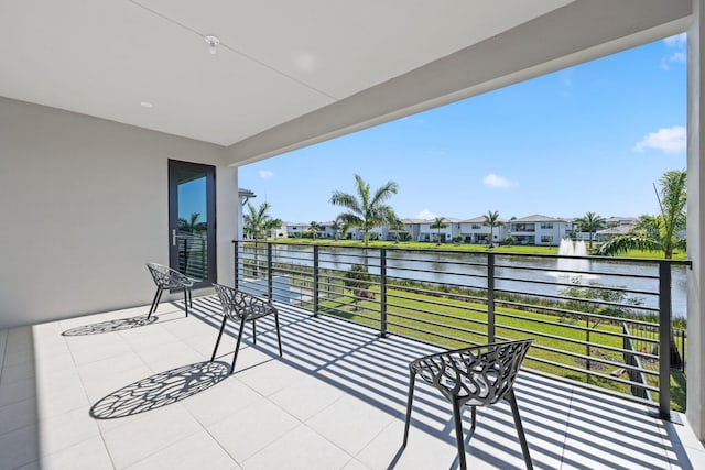 balcony featuring a water view