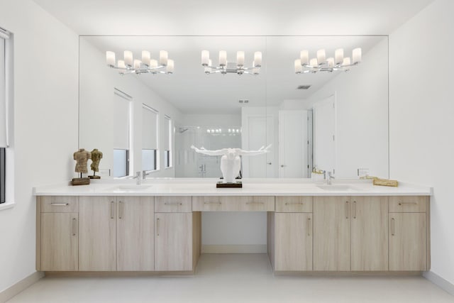 bathroom featuring tile patterned flooring, vanity, and an enclosed shower