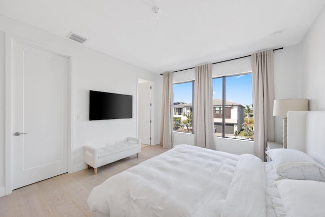 bedroom with light wood-type flooring