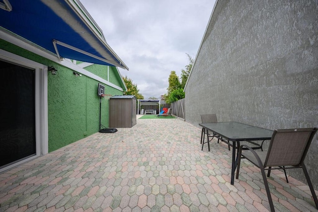 view of patio / terrace featuring a shed