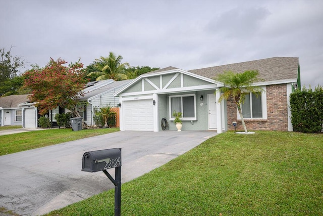 ranch-style house featuring a front lawn and a garage