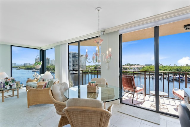 sunroom / solarium with a healthy amount of sunlight and a water view