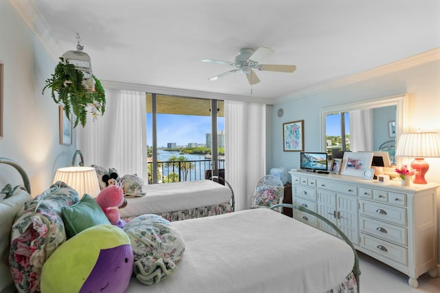 bedroom featuring multiple windows, access to exterior, ceiling fan, and crown molding