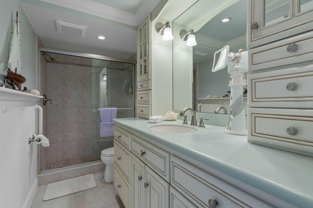 bathroom with toilet, crown molding, vanity, tile patterned floors, and a shower with door