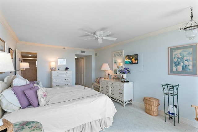 carpeted bedroom featuring ornamental molding and ceiling fan