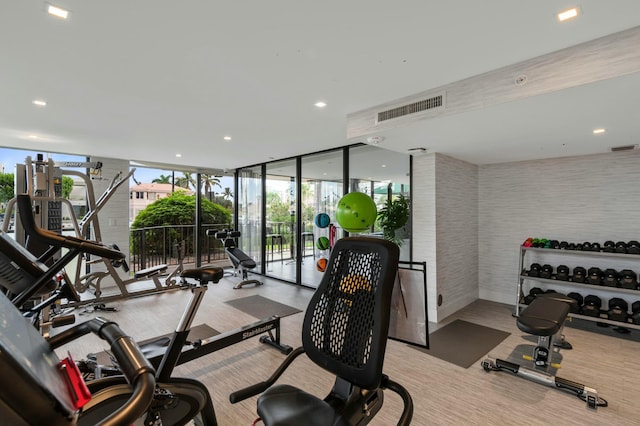 workout area featuring floor to ceiling windows