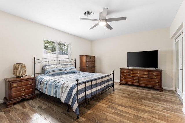 bedroom featuring ceiling fan and dark hardwood / wood-style floors