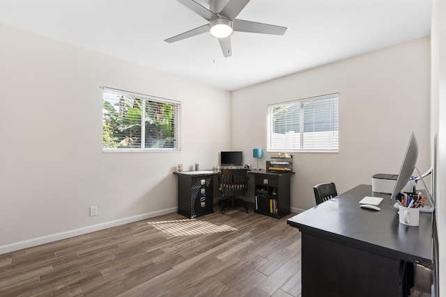 office space with ceiling fan and dark wood-type flooring