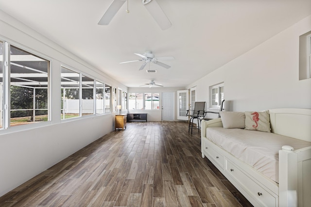 sunroom with ceiling fan