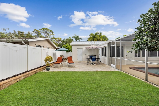 view of yard featuring a lanai and a patio area