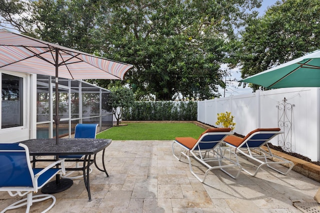 view of patio with a lanai