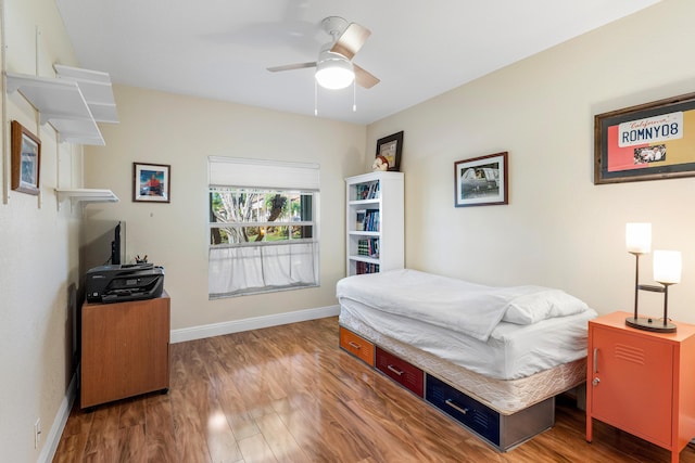 bedroom featuring hardwood / wood-style flooring and ceiling fan