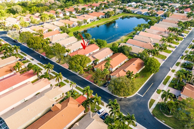 birds eye view of property with a residential view and a water view