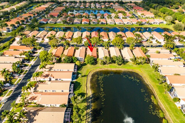 bird's eye view with a water view and a residential view