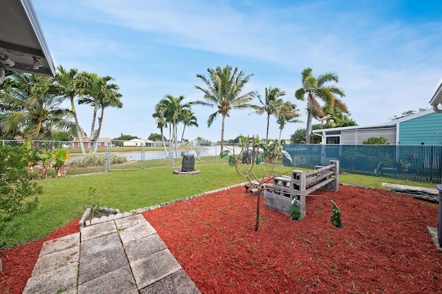 view of yard featuring a patio and a water view