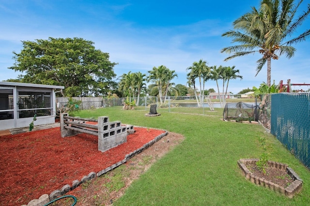 view of yard with a sunroom