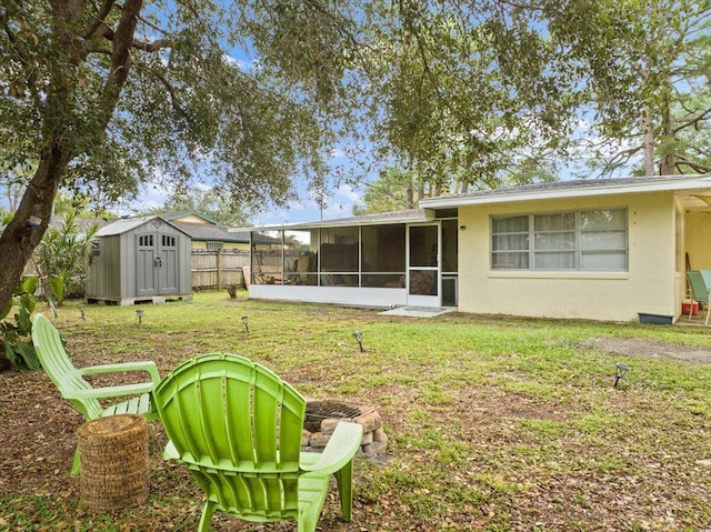 view of yard with a storage shed and a sunroom