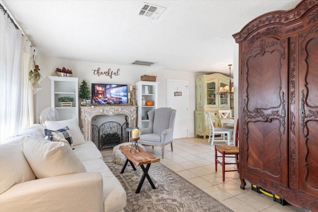 tiled living room with a textured ceiling