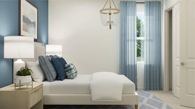 bedroom with a chandelier and light colored carpet