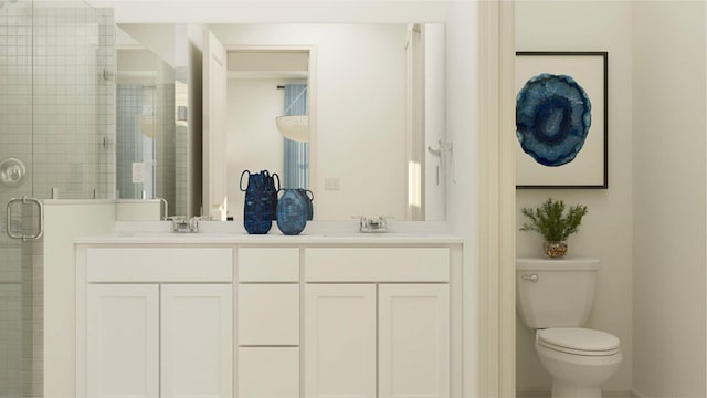 bathroom with vanity, a shower with shower door, and toilet