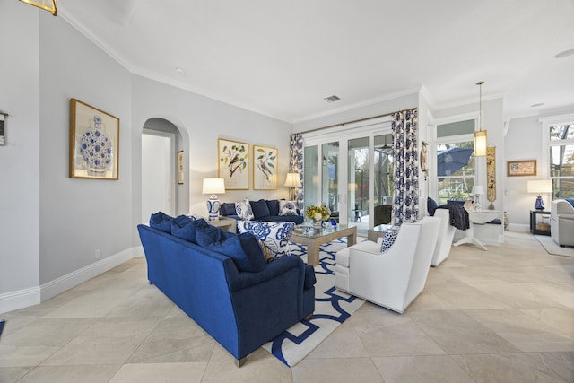 living room featuring french doors, light tile patterned flooring, and crown molding