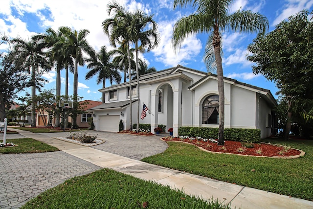 view of front facade with a garage and a front yard