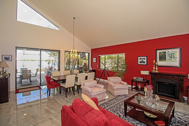 dining area with high vaulted ceiling and a chandelier