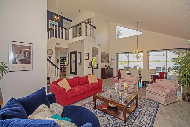 living room featuring a chandelier and a textured ceiling