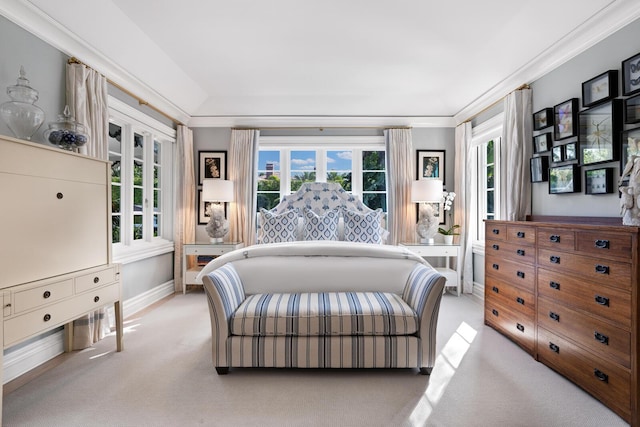 carpeted bedroom with lofted ceiling, ornamental molding, and multiple windows