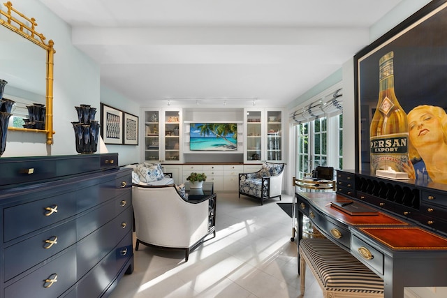 interior space featuring built in shelves and light tile patterned floors