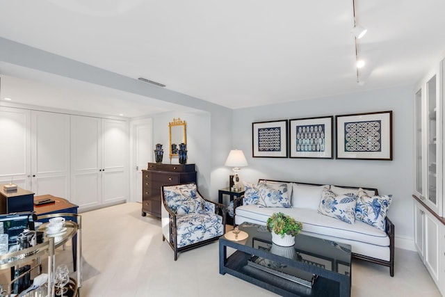 living room featuring rail lighting