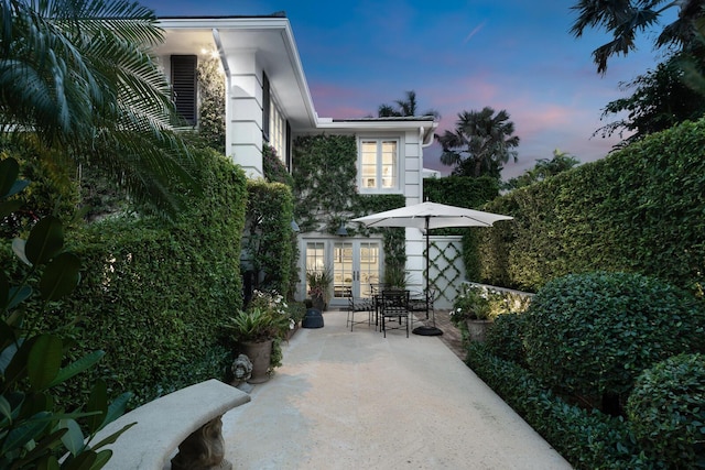 patio terrace at dusk with french doors