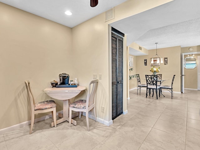 dining room with a textured ceiling