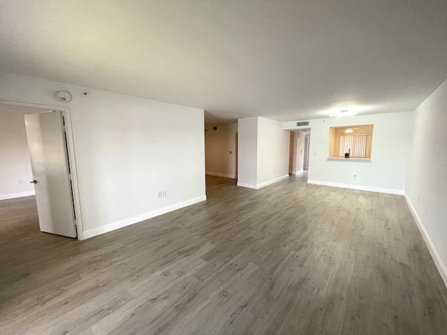 unfurnished living room with hardwood / wood-style flooring