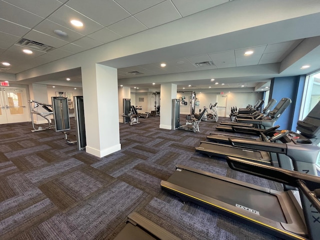 workout area with dark carpet