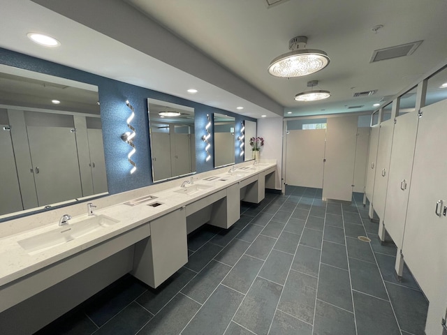 bathroom featuring tile patterned flooring and vanity