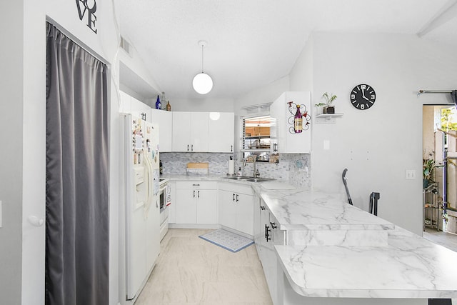 kitchen featuring white cabinets, white refrigerator with ice dispenser, tasteful backsplash, sink, and kitchen peninsula