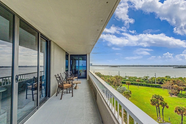 balcony featuring a water view