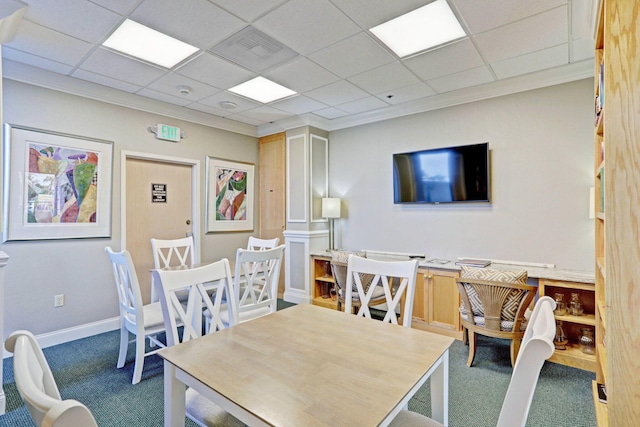 dining space with carpet floors, decorative columns, a paneled ceiling, and ornamental molding