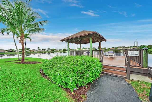 exterior space featuring a water view, a gazebo, and a yard