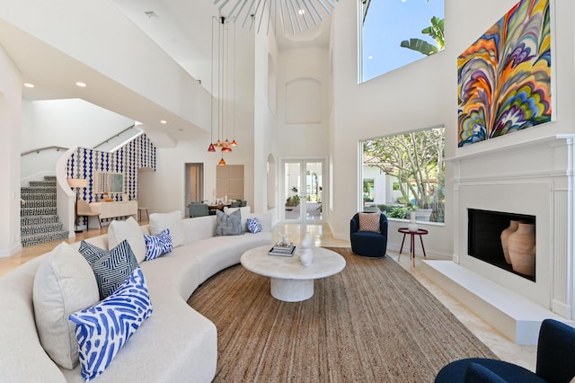 living room featuring a towering ceiling