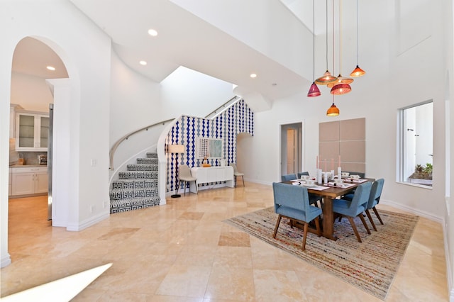 dining room with a high ceiling