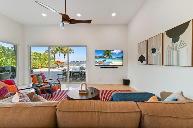 living room with carpet flooring and ceiling fan