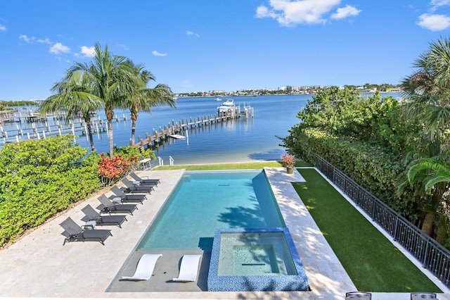 view of swimming pool featuring an in ground hot tub and a water view