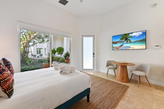 bedroom featuring access to outside and light tile patterned floors