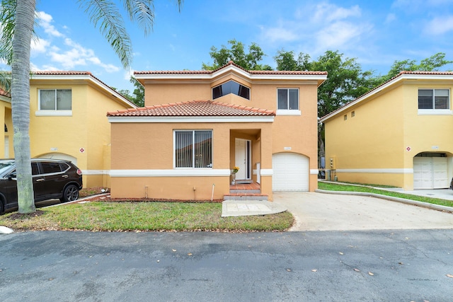 mediterranean / spanish-style home featuring a garage