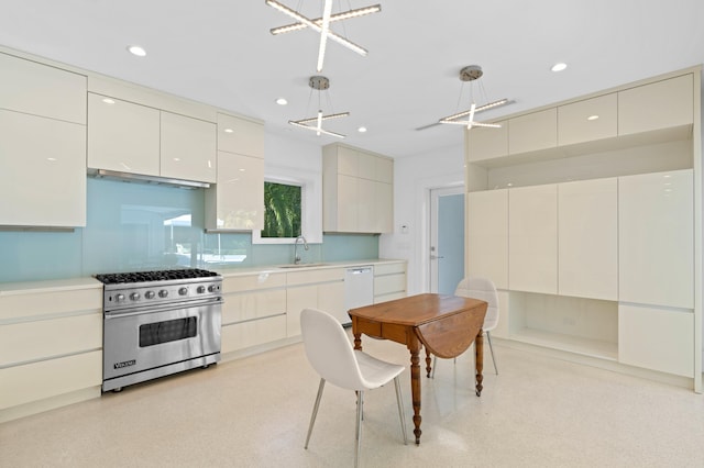 kitchen featuring exhaust hood, white dishwasher, hanging light fixtures, sink, and designer stove