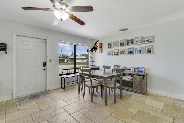 dining room featuring ceiling fan