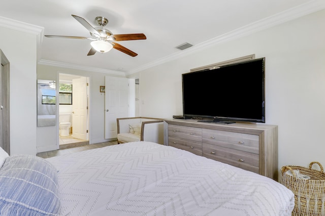 bedroom featuring ceiling fan, ornamental molding, connected bathroom, and light hardwood / wood-style flooring